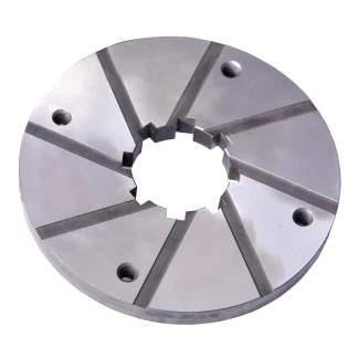 The PDC stationary cutter plate: a steel ring with radial slots and a toothed centre