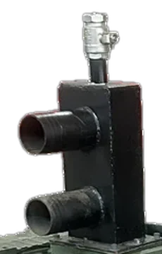 Black inlet head with two pipe connections and a valve on top